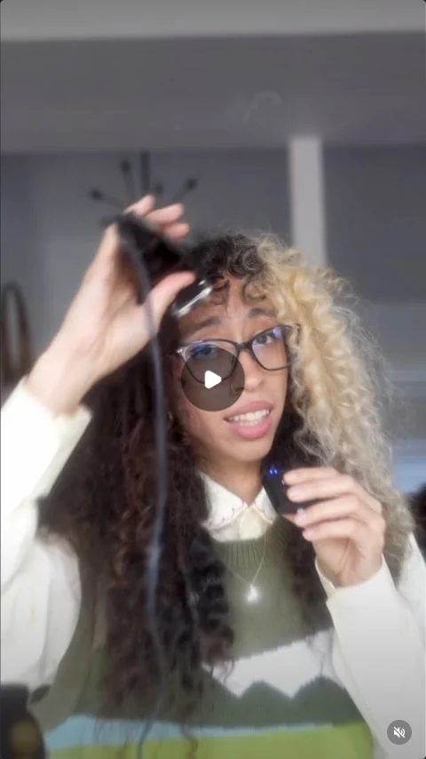 A creator demonstrating an apparent haircut as a visual hook.
